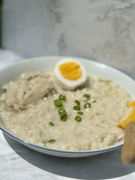 A bowl of chicken rice porridge