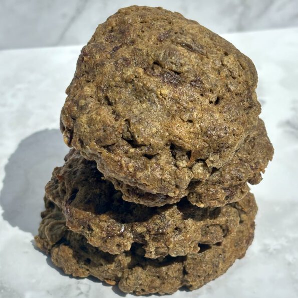 A closeup of a stack of chocolate-banana-hemp cookies.