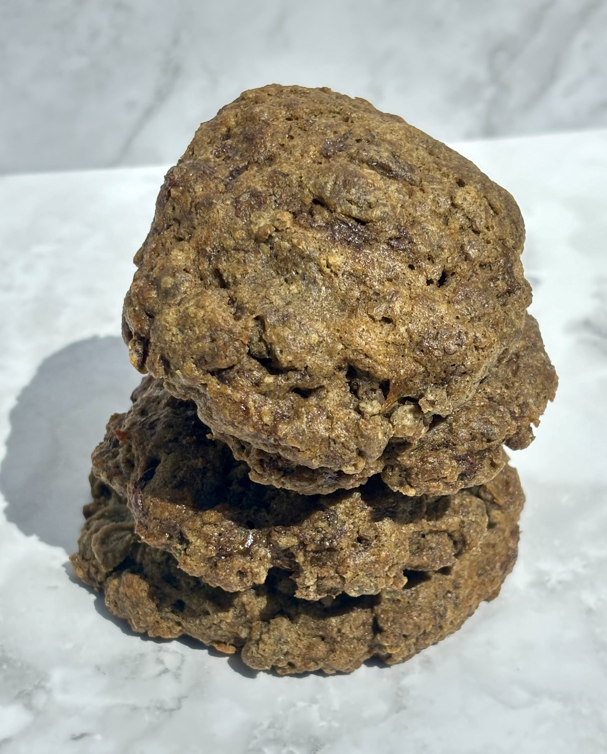 A closeup of a stack of chocolate-banana-hemp cookies.