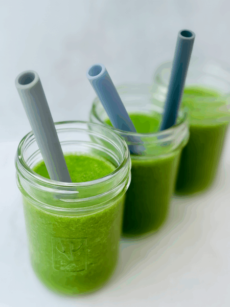 A green smoothie for toddlers is displayed in a toddler bottle.