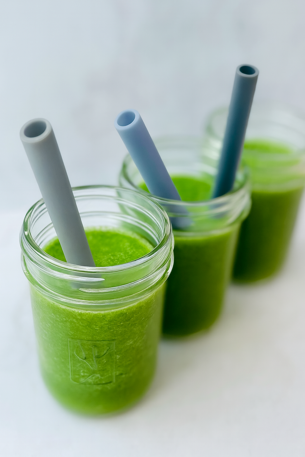 A green smoothie for toddlers is displayed in a toddler bottle.