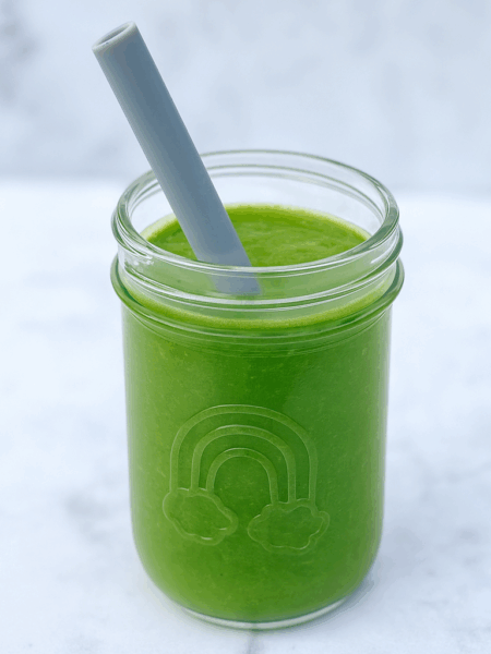 A green smoothie for toddlers is displayed in a toddler bottle.