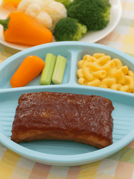 Ribs for kids: it's possible! A set of saucy, fall-off-the-bone ribs are sided with cucumber slices.