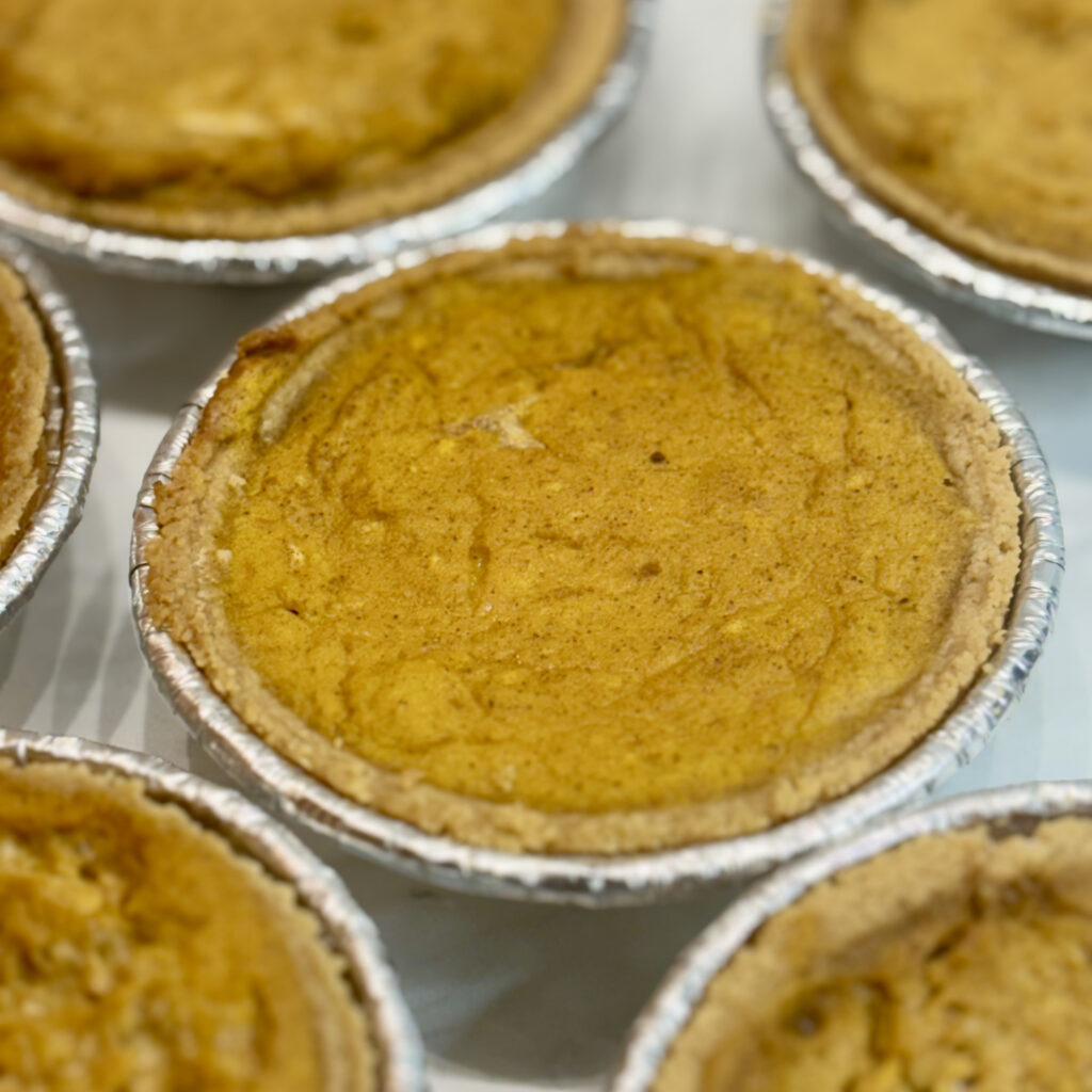 A mini pumpkin pie for toddlers is displayed, with similar pies surrounding it.