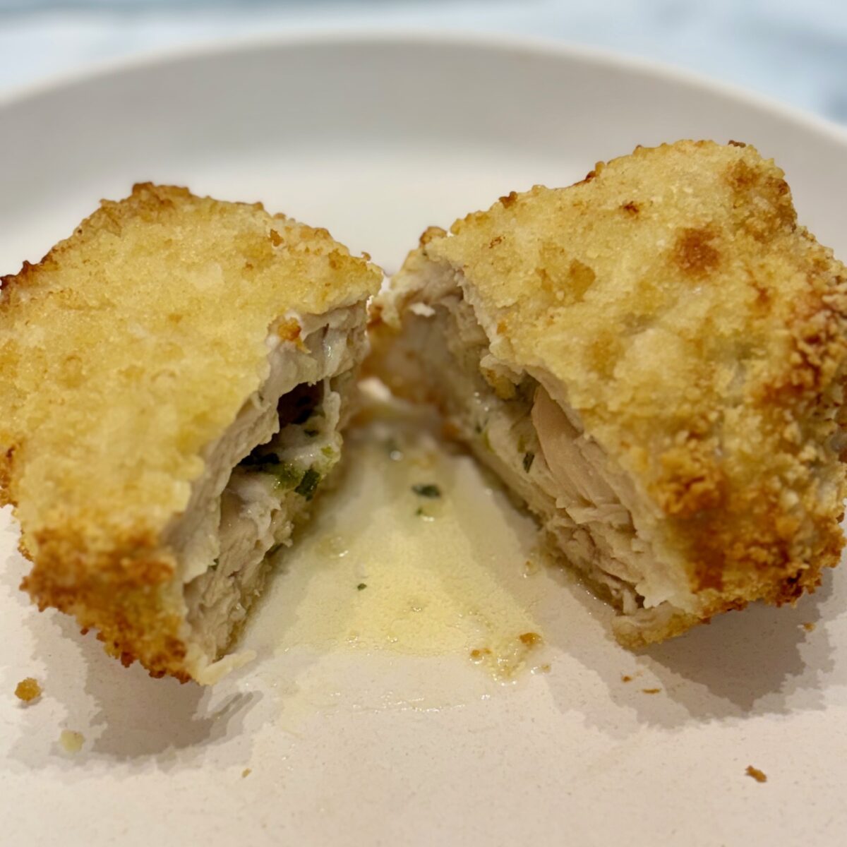 Chicken Kiev, split open to show butter sauce.