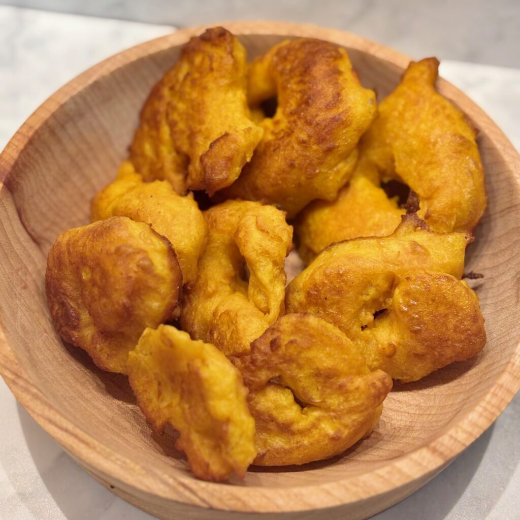 A basketful of the veggie donuts known as picarones