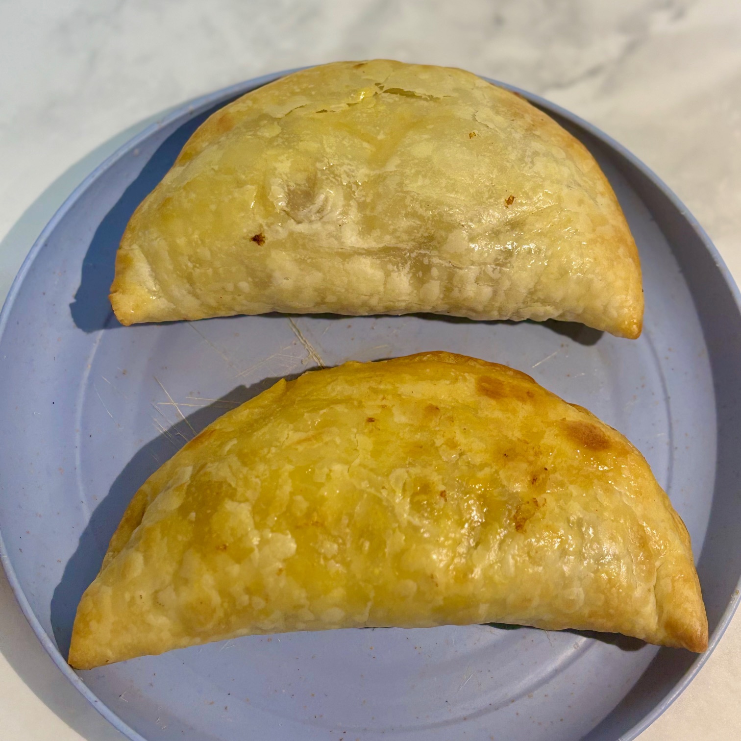 Two empanadas filled with lamb keema sloppy joes are examples of easy puff pastry recipe for toddler that utilize frozen dough.