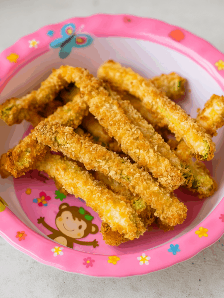 toddler veggies fries, made from zucchini, are presented in a bowl.