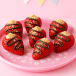 Strawberries stuffed with ricotta and drizzled with chocolate make for an excellent toddler snack idea.