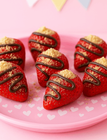 Strawberries stuffed with ricotta and drizzled with chocolate make for an excellent toddler snack idea.
