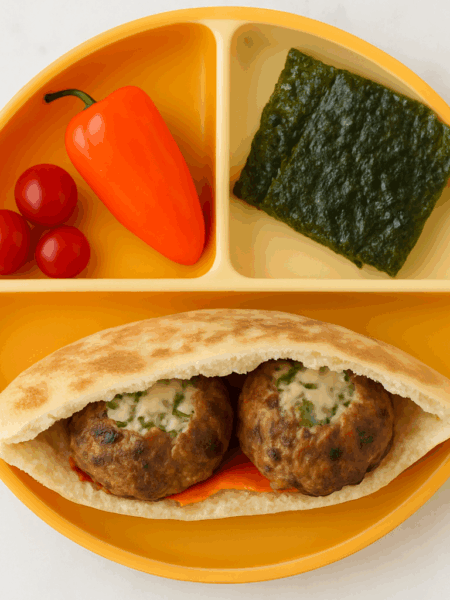 This kofta-filled pita sandwich, made with leftover ground beef, is an ideal toddler lunch. Here, two spiced meat patties are stuffed into a pita along with yogurt sauce and hummus.