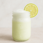 A frothy glass of frozen lemonade for kids is shown.