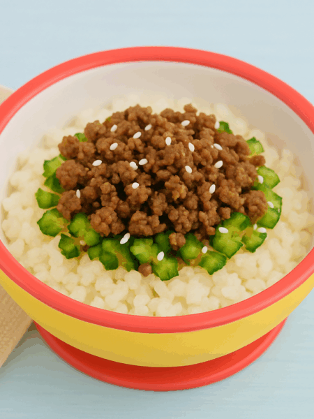 A beef and cucumber stir fry is a simple ground beef recipe for kids for weeknights. Here, a layer of rice is topped with slices of cucumbers and marinated beef.