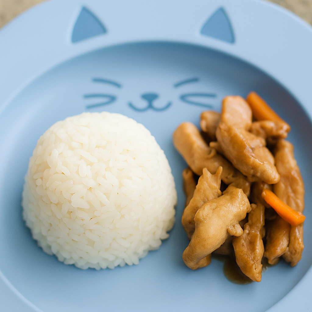 A mound of rice for toddlers, sided with a chicken stir fry.