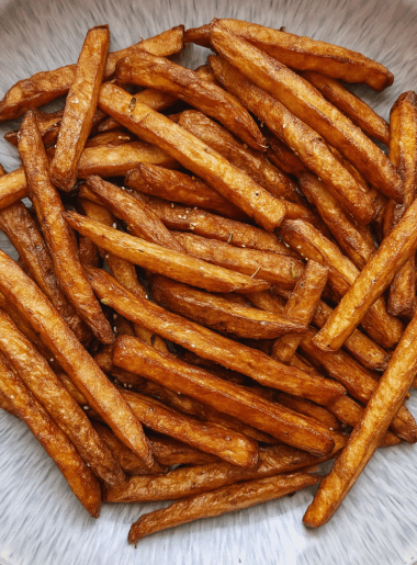 A bowl full of air fryer french fries.