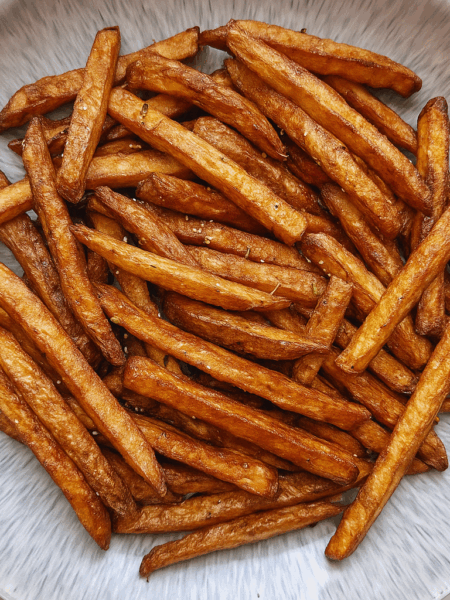 A bowl full of air fryer french fries.