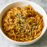 Buttered noodles for kids, here presented as udon soaked in hoisin butter and showered with parmesan.