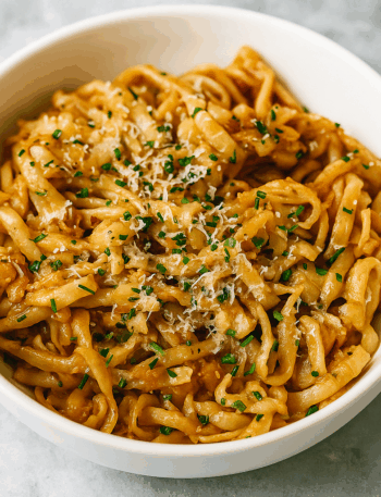 Buttered noodles for kids, here presented as udon soaked in hoisin butter and showered with parmesan.
