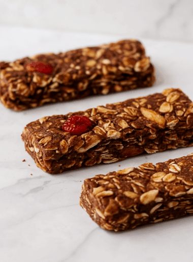 A row of homemade chocolate cherry almond granola bars for kids