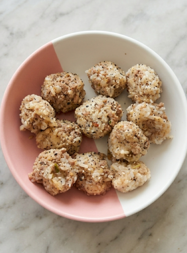 A bowl of toddler-friendly rice balls with ground beef mixed in.