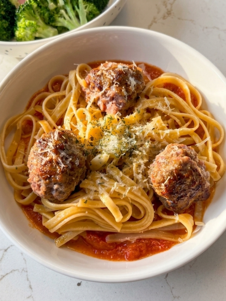Bowl of toddler spaghetti and meatballs.